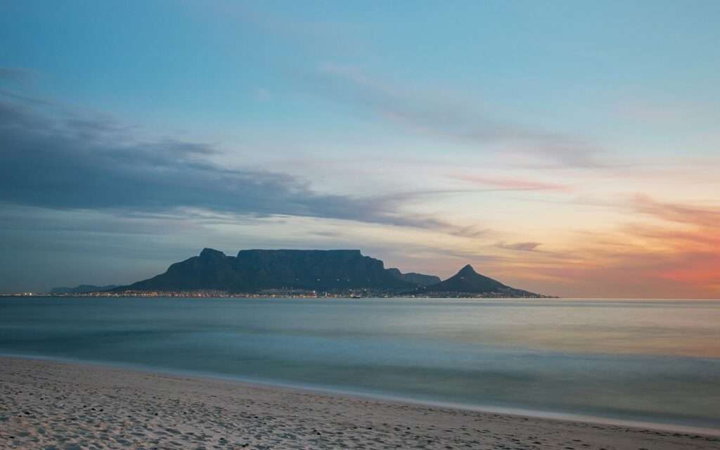 Table Mountain across the bay from Bloubergstrand at dusk